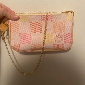 Pink and yellow clutch purse